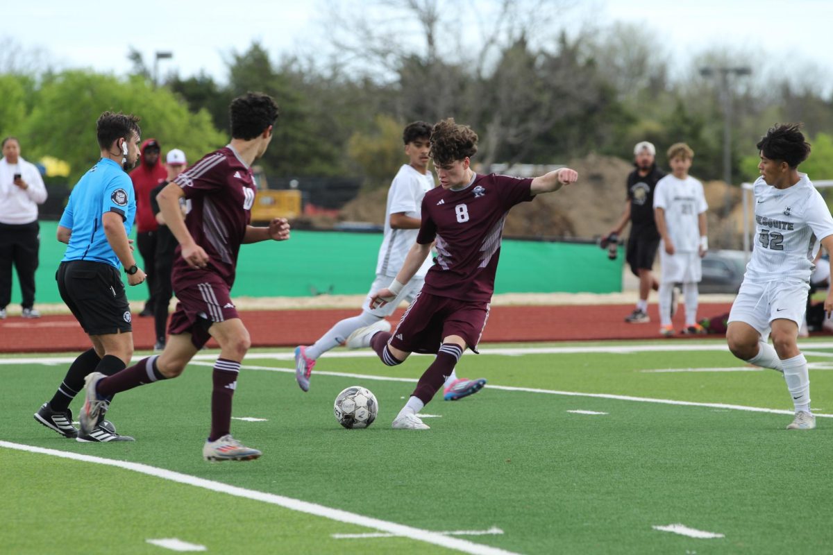 Run it back. Preying on the ball, senior Henry Salmaron, center midfielder, returns the ball to the targeted goal at the Rowlett vs Mesquite playoff game. The game took place at the Rowlett High School field during the school day bringing in students to cheer their team on. "I feel like it was hectic, a lot was going on the whole time," Salmeron said. "The pressure, all the students sitting on the stands."