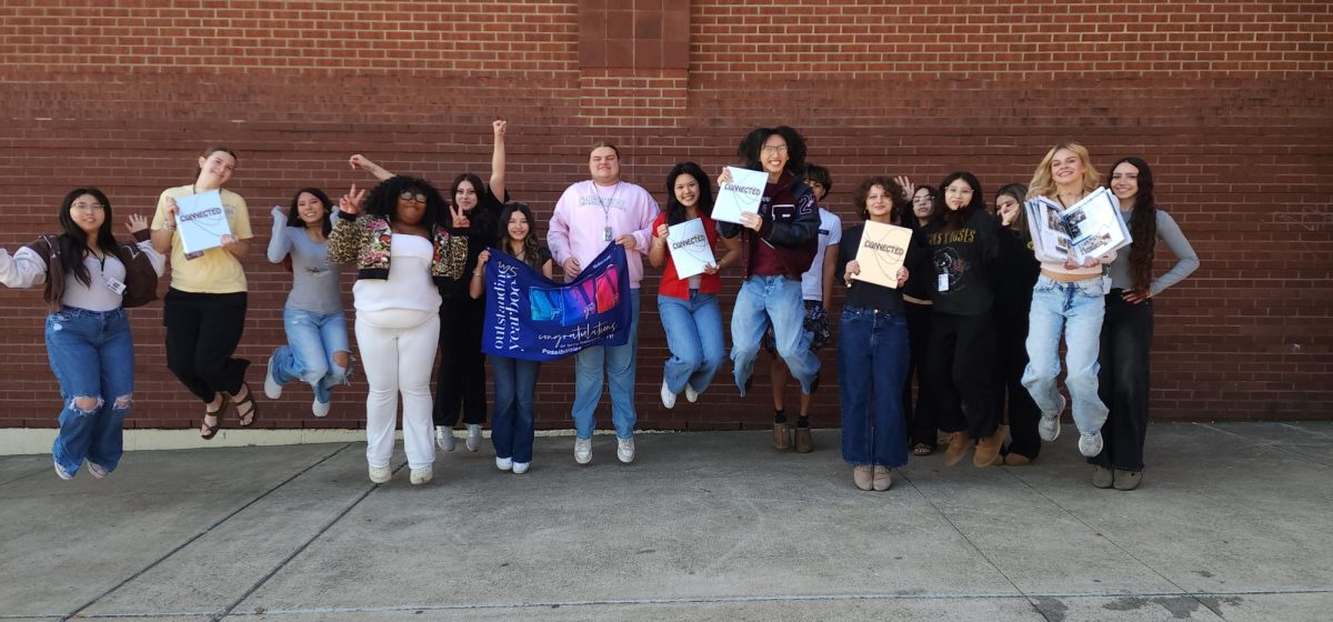 The Yearbook team celebrate their recognition award for the 2025 book, 'Connected'